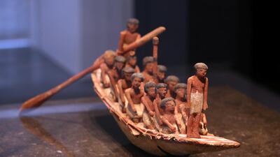 An ancient Egyptian model of a funerary boat and its crew. Chris Whiteoak / The National