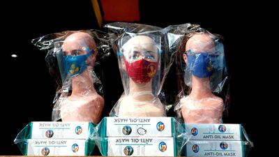 Mannequins wearing protective face masks and face shields are displayed at a market in Jakarta, Indonesia. Reuters