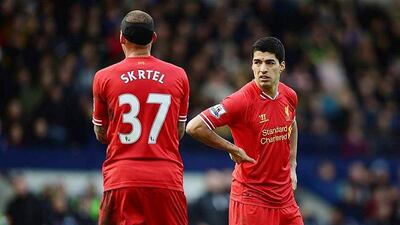 Liverpool defender Martin Skrtel and forward Luis Suarez cut a sorry figure after a blunder cost them a win against West Bromwich Albion. Jamie McDonald / Getty Images