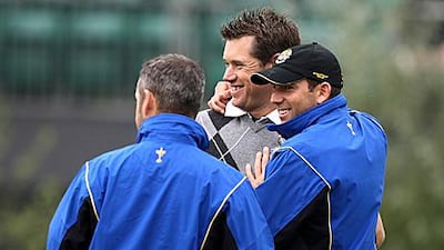 Sergio Garcia, right, shares a joke with Europe’s Lee Westwood, centre, during a practice round at Celtic Manor this week. Paul Childs / Action Images