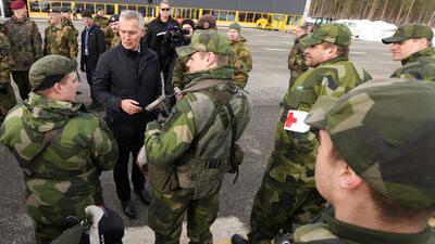 Nato Secretary General Jens Stoltenberg with Swedish troops during an exercise in the Arctic Circle. Reuters