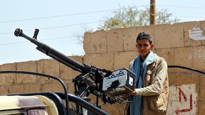 A young member of Houthi militia mans a heavy calibre machine gun at a checkpoint, amid heightened security measures in Sanaa, Yemen. Yahya Arhab / EPA