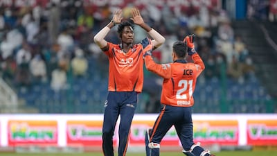 Dominic Drakes, left, celebrates a wicket with Rahmanullah Gurbaz. Photo: Abu Dhabi T10