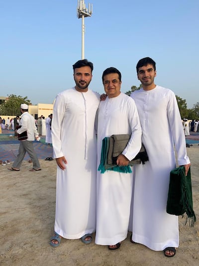 Abdul Karim Hanif, left, with his father and brother during Eid prayers. Photo: Abdul Karim Hanif