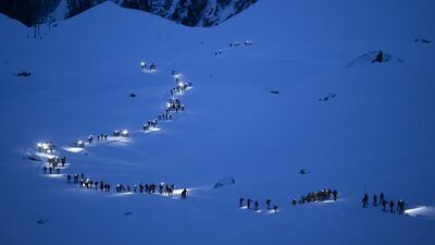 Competitors in the 24th Glacier Patrol race in the Swiss Alps between Arolla and Verbier, Switzerland, on April 21 climb towards the Tsena Refien pass. EPA