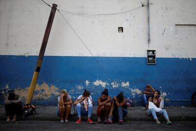 Relatives of inmates wait outside the police centre, where a fire occurred in the cells area. Carlos Garcia Rawlins / Reuters