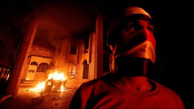 Iraqi protesters burn the Iranian Consulate in Basra. REUTERS