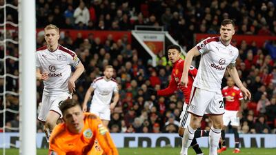 Jesse Lingard, centre, scores Manchester United's first goal in the 2-2 draw against Burnley. Martin Rickett / PA