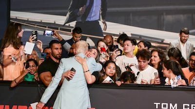 A fan hugs actor Simon Pegg