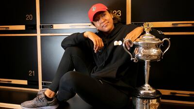 Japan's Naomi Osaka posing with her winning trophy at the Australia Open in February. AFP