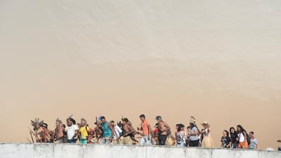 Brazilian natives from different ethnic groups protest atop of the National Congress in Brasilia. The demonstration is aimed to attract the attention on the Amazonia situation in the framework of next Fifa World Cup. Evaristo SA / AFP