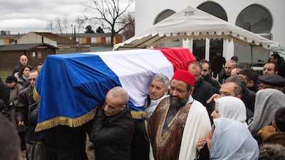 A coffin carrying the body of a murdered police officer is taken to a Muslim cemetery in Bobigny, France on January 13, 2015. Dan Kitwood / Getty Images