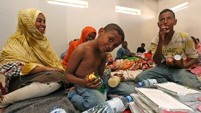 Yemeni children wait to eat donated food at a temporary shelter in the port town of Bosasso in Somalia's Puntland on April 17, 2015, after fleeing the violence in Yemen. Feisal Omar/Reuters