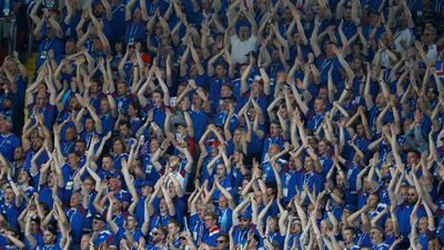 The famously loud Iceland fans cheer their side on. Kai Pfaffenbach / Reuters