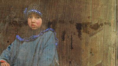 An Indian child looks out of a window as union minister, patron for the National Conference and candidate for Srinagar’s seat for the lower house of parliament in India’s general election Farooq Abdullah speaks during an election rally in Rawalpora village. Rouf Bhat / AFP