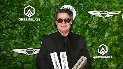 Jafar Panahi with the three Gotham Awards he received in the US. AP