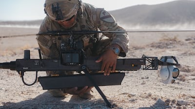 A solider checks an Anduril Industries Ghost-X reconnaissance drone at the National Training Centre in Fort Irwin, California. Bloomberg