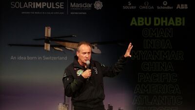 Pilot Andre Borschberg explains the route of the Solar Impulse aircraft after its scheduled departure from Al Bateen Executive Airport in Abu Dhabi on Monday morning. Organisers hope to celebrate their record back on Emirati soil in the summer. Christopher Pike / The National