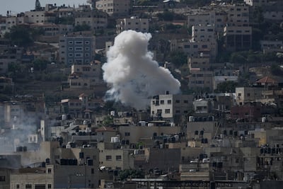 Smoke rises during an Israeli military raid of the militant stronghold of Jenin in the occupied West Bank on Monday. AP