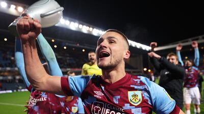 BLACKBURN, ENGLAND - APRIL 25: Taylor Harwood-Bellis of Burnley celebrates with teammates after winning the Sky Bet Championship following victory against Blackburn Rovers after the Sky Bet Championship between Blackburn Rovers and Burnley at Ewood Park on April 25, 2023 in Blackburn, England. (Photo by Matt McNulty / Getty Images)
