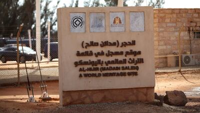 A sign sits at the entrance to the ancient rock heritage site at Al Ula, Saudi Arabia. Saudi Arabia's Crown Prince Mohammed Bin Salman officially launched his vision of the mega tourism project at the ancient site of Al Ula. Bloomberg