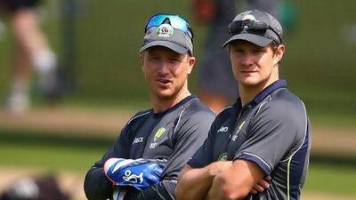 Brad Haddin, left, and Shane Watson watch as Australians go through the paces during a training session yesterday. Ryan Pierse / Getty Images