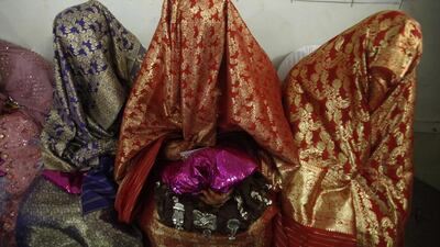 Brides sit together during a mass wedding ceremony in Peshawar. A total of 25 couples from the Pakistan’s northwest province of Khyber Pakhtunkhwa participated in the ceremony, organised by Al-Khidmat Foundation, a welfare organisation of Pakistan’s political and religious party Jammat-e-Islami. Fayaz Aziz / Reuters / April 25, 2014