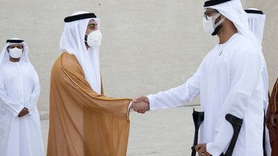 Sheikh Zayed bin Hamdan bin Zayed (R) greets Sheikh Zayed bin Mansour bin Zayed at the wedding.