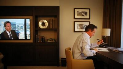 prime minister David Cameron prepares his keynote speech in his hotel room at the Conservative party conference as his image appears on a TV news broadcast (L) Birmingham, England. Tomorrow is the final day of conference. Peter Macdiarmid / Getty