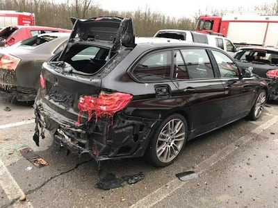 This picture taken on December 12, 2017 shows a burnt car parked near Austria's main gas pipeline hub at Baumgarten, Eastern Vienna, where an explosion rocked the site. AFP