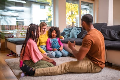 Parents act as real-time interpreters of the world for their children. Getty Images