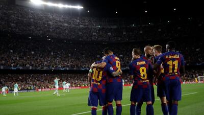 Barcelona players celebrate their side's second goal. AP Photo