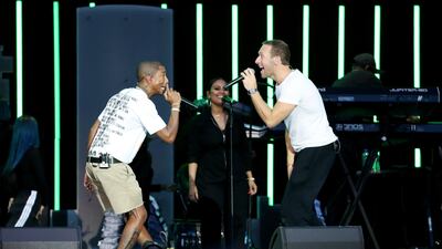 Pharrell Williams and Chris Martin perform a duet at the FNB Stadium. Getty