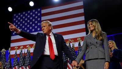 President-elect Donald Trump stands on stage with his wife Melania during a rally on election in West Palm Beach, Florida. Reuters