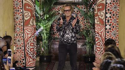 Roberto Cavalli fashion house creative director Peter Dundas acknowledges the applause of the audience after presenting the Roberto Cavalli women’s Spring-Summer 2017 collection, in Milan, Italy. Roberto Cavalli CEO Giacomo Ferraris said Wednesday, Oct. 12, 2016, that Dundas, who took over in March 2015, is leaving the house, as it’s going through a period of transformation and that a new creative director will be named. AP Photo/Luca Bruno