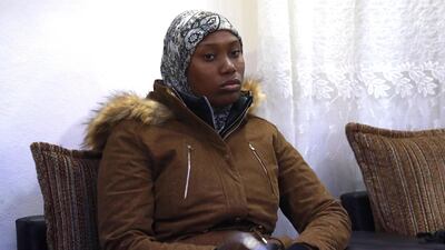The mother of two Caribbean children, who were handed over to her by Syrian Kurds four years after their militant father brought them to the ISIS's "caliphate", is pictured in the city of Qamishli. AFP