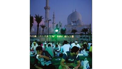 Men break their fast this month during iftar at Abu Dhabi's Sheikh Zayed Mosque.