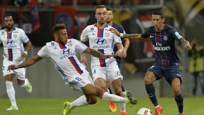 Paris Saint-Germain’s Argentinian forward Angel Di Maria (R) is tackled by Lyon’s French midfielder Nabil Fekir during the Trophee des Champions ‘super cup’ match between PSG and Lyon in Klagenfurt, Austria, on August 6, 2016. Samuel Kubani / AFP