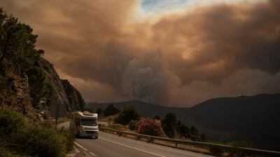 Smoke from a wildfire in the Sierra Bermeja range in Malaga. About 2,000 people were moved from the area of southern Spain, which was badly hit by wildfires just nine months ago. AFP