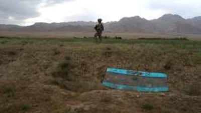 A soldier patrols along the treacherous motorway linking Kabul with Herat.