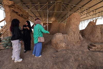 Iraqi researchers visit the ruins at the Tell Muhammad archaeological site. AFP