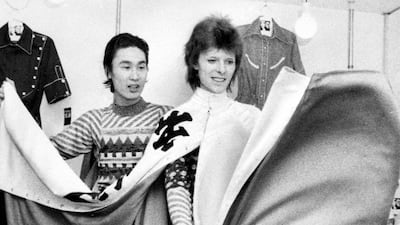Designer Kansai Yamamoto with singer David Bowie at a costume fitting session in 1973 in Tokyo, Japan. Getty Images