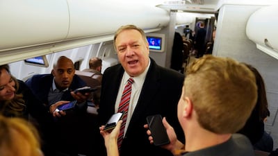 US Secretary of State Mike Pompeo speaks to reporters aboard his plane en route to London, Britain, January 29, 2020. Pompeo is on a foreign trip to eastern Europe and Central Asia. / AFP / POOL / KEVIN LAMARQUE
