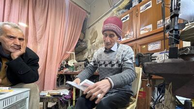 Mr Sharab passes the time with an old friend during a break from his work