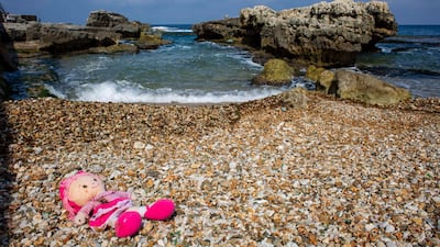 A doll lies on a beach at rocky coastal area at Beirut's seaside corniche which is almost empty of residents and tourists due to the coronavirus pandemic in Beirut, Lebanon. AP Photo