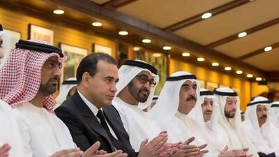 Sheikh Mohammed bin Zayed, Crown Prince of Abu Dhabi and Deputy Supreme Commander of the Armed Forces, fourth left, Sheikh Rashid bin Saud Al Mu'alla Crown Prince of Umm Al Quwain, left, Sheikh Ammar bin Humaid Al Nuaimi, Crown Prince of Ajman, second left, Sheikh Saud bin Rashid Al Mu'alla, Supreme Council Member and Ruler of Umm Al Quwain, fifth left, and others applaud a Ramadan lecture by Terry Garcia, head of core mission programmes for the National Geographic Society, not shown. The lecture at Al Bateen palace was titled "The New Age of Exploration". Ryan Carter / Crown Prince Court - Abu Dhabi
