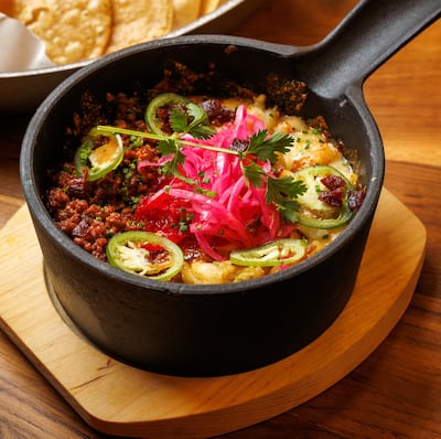 Sizzling cheese comes with beef and shrimps, but can also be ordered as a vegetarian option. Photo: Rodeo Drive