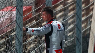 Nico Hulkenberg looks on as his car is towed away. Victor Besa / The National