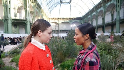 Actress Kristine Froseth, left, talks with Canadian actress Taylor Russell before the Chanel Haute Couture Spring/Summer 2020 show. AP