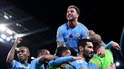 Ilkay Gundogan of Manchester City (second right) celebrates with teammates after scoring his team's third goal during the Premier League match between Manchester City and Manchester United. Getty